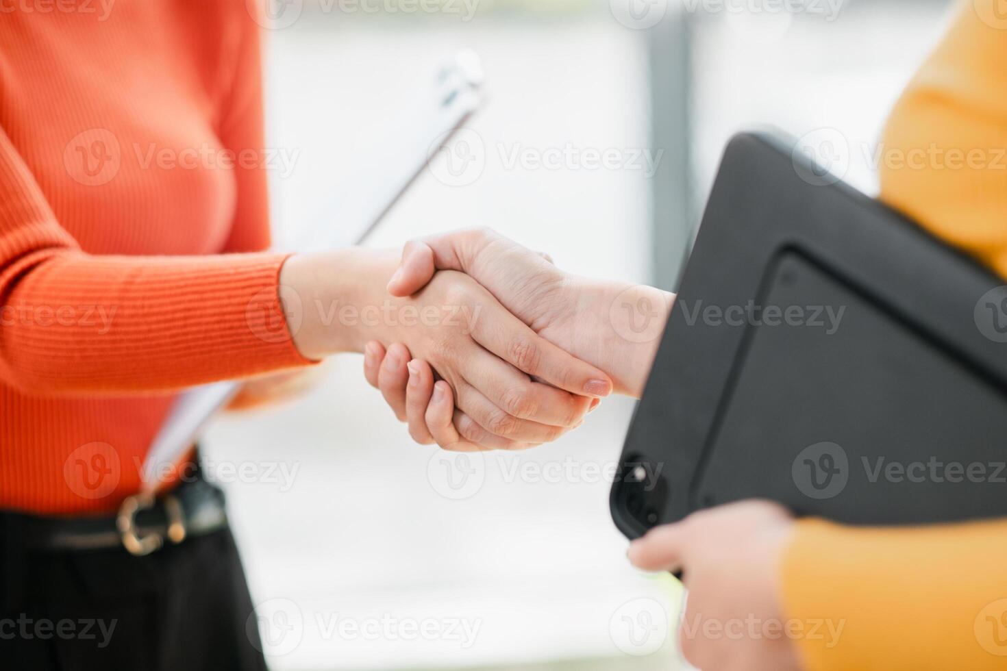 Close-up image of a handshake between two individuals, representing collaboration and successful business partnerships. photo