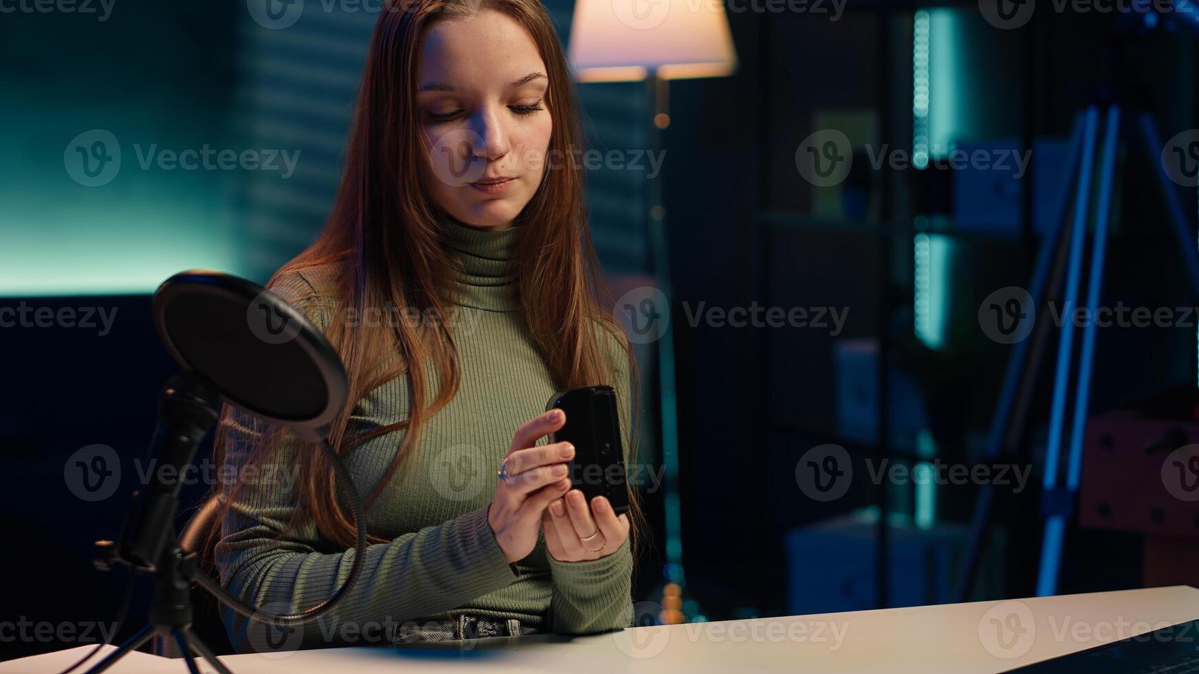 Tech expert holding V mount battery ensuring ample power to fuel production equipment, showing it to subscribers. Gen Z influencer vouching for professional charging device brand, camera A photo
