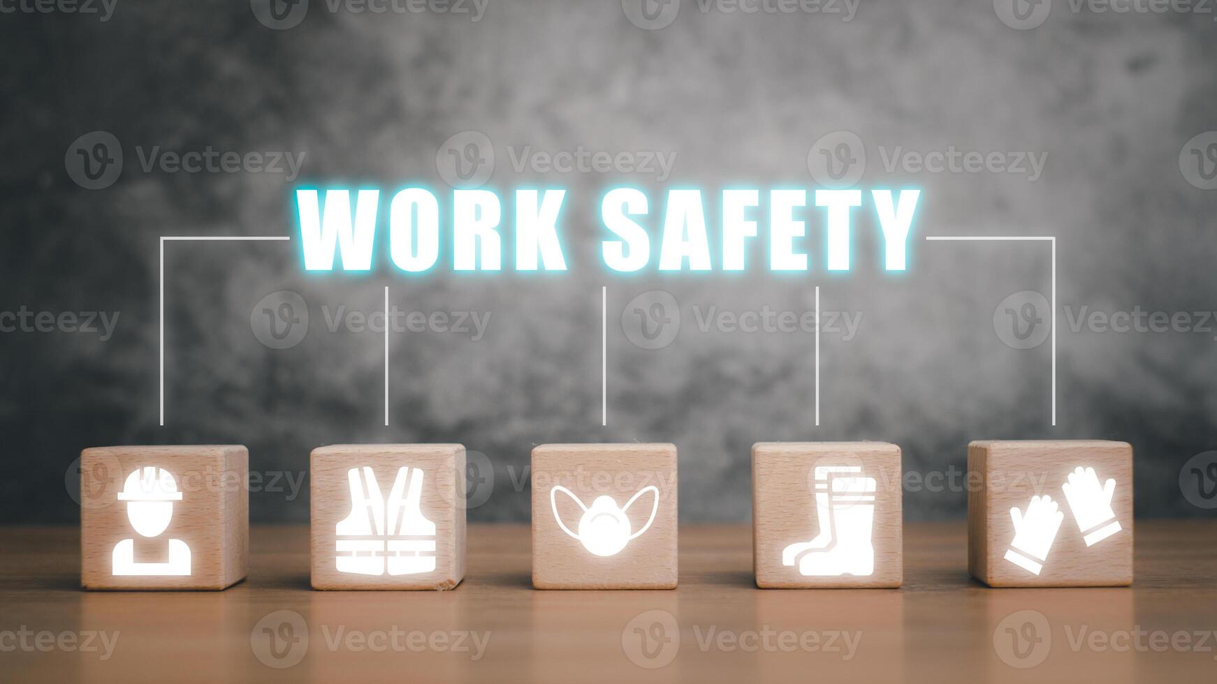 Work safety concept, Wooden cube block on desk with work safety icon with copy space. photo