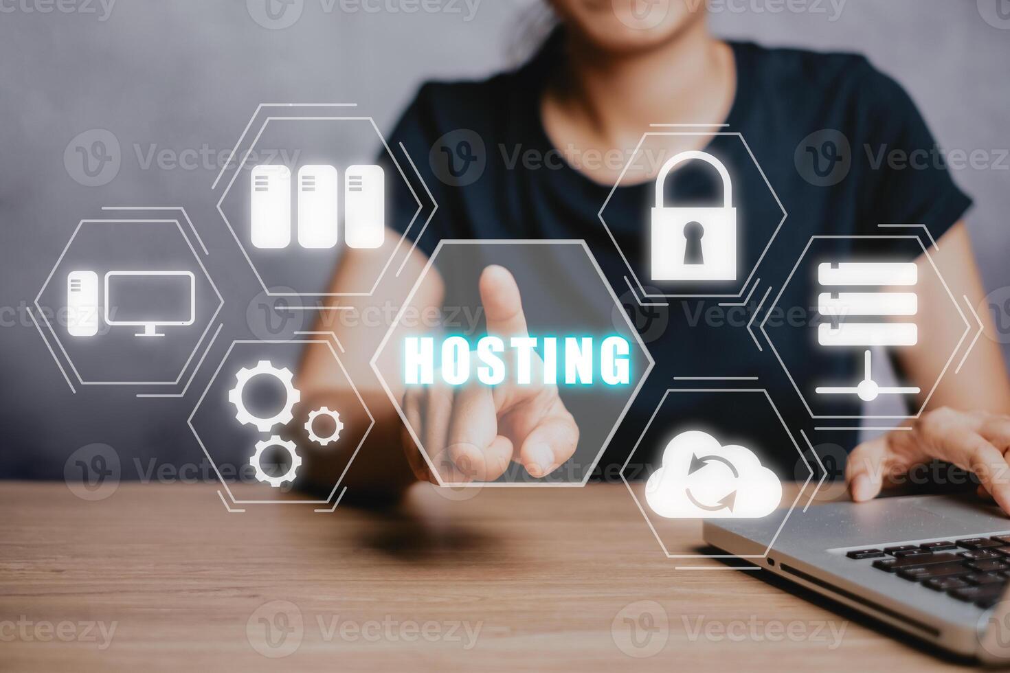 Web hosting concept, Woan using computer and presses his finger on the virtual screen inscription Hosting on desk, Internet, business, Technology and network concept. photo
