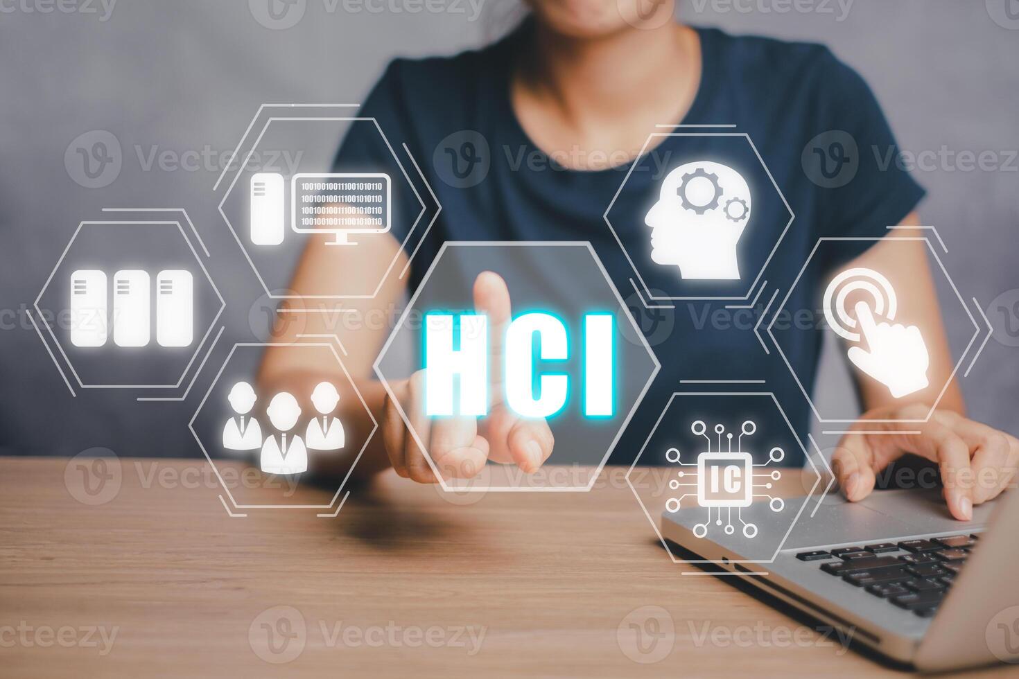 HCI concept, Human computer interaction, Person hand using computer on office desk with HCI icon on virtual screen. photo