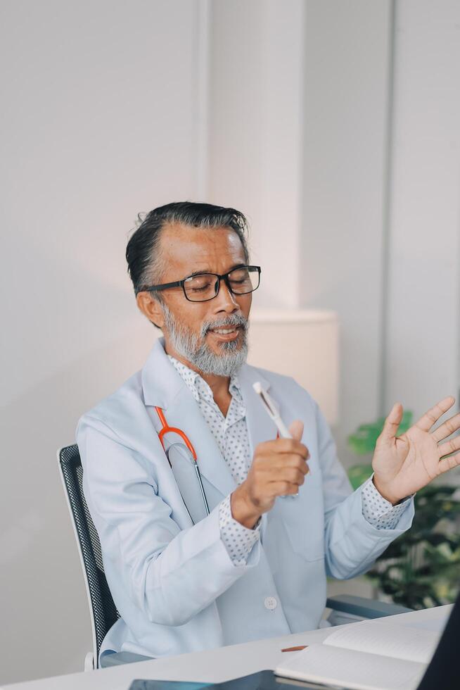 A man in a doctor's coat is talking to a woman photo