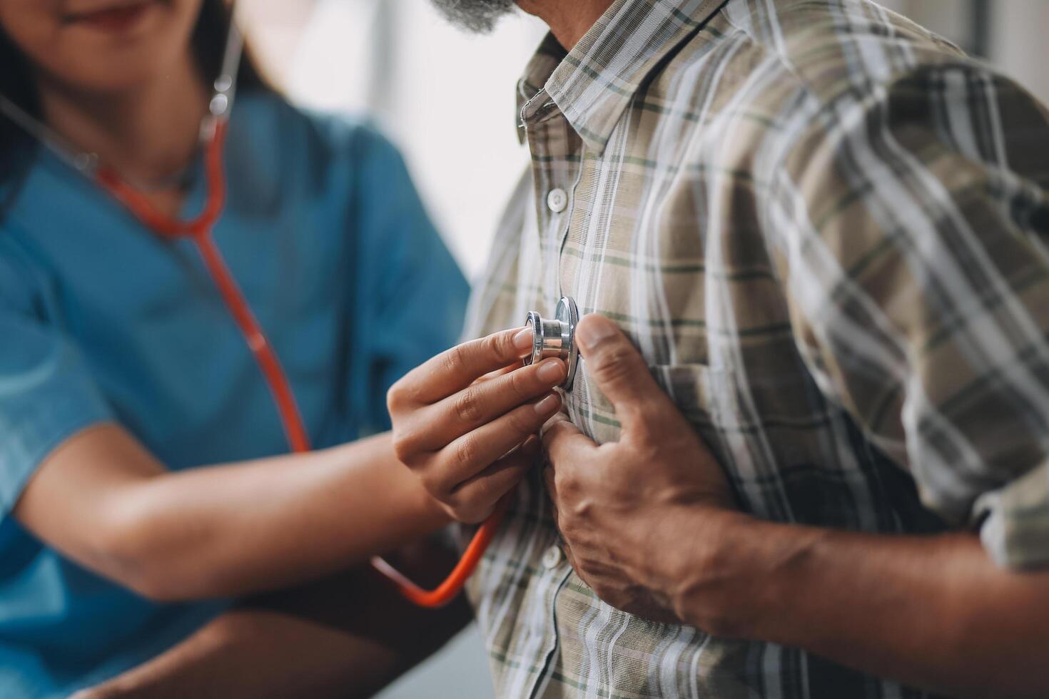 A doctor checking the heart rate of a patient photo