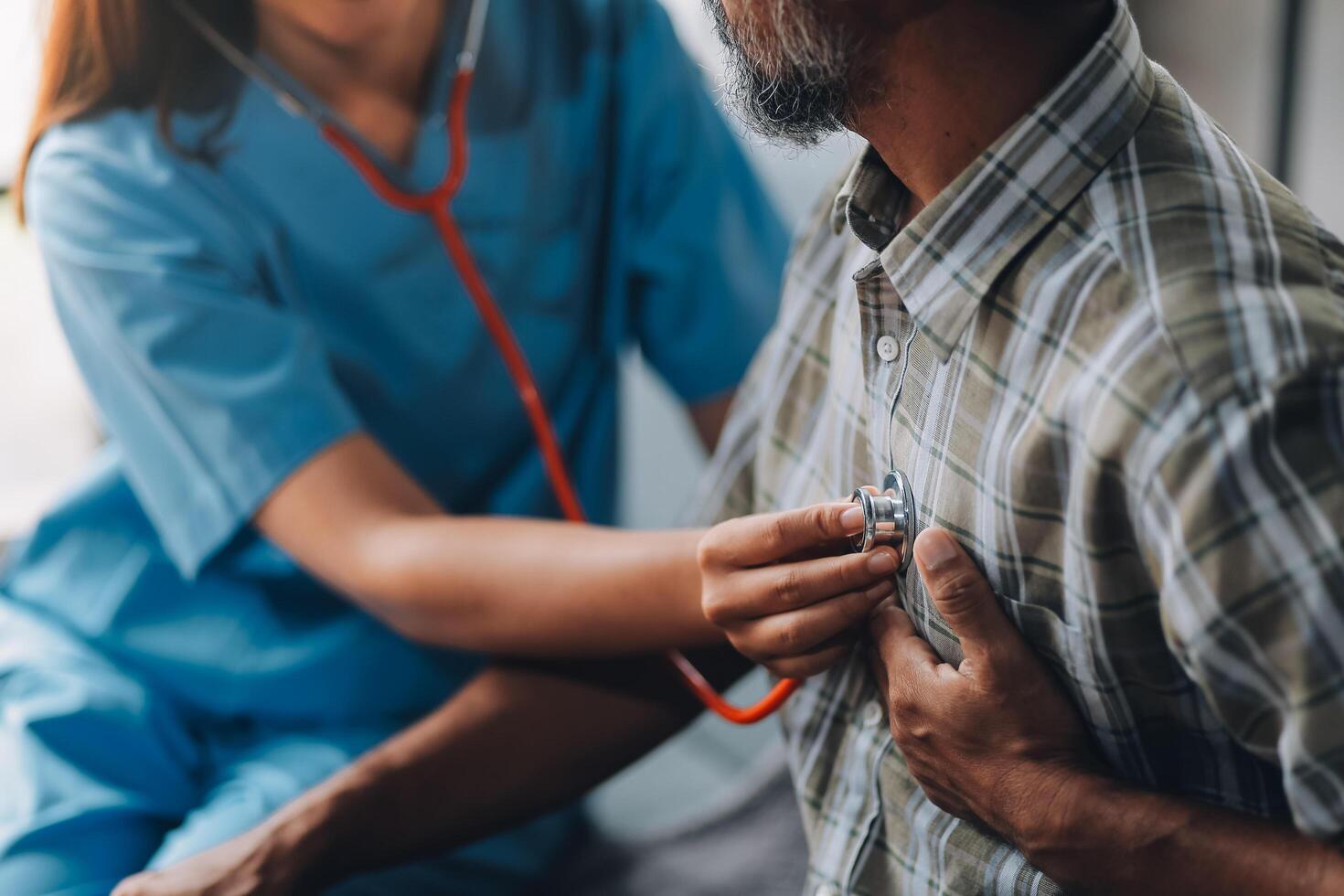 A nurse checking the heart rate of a patient photo