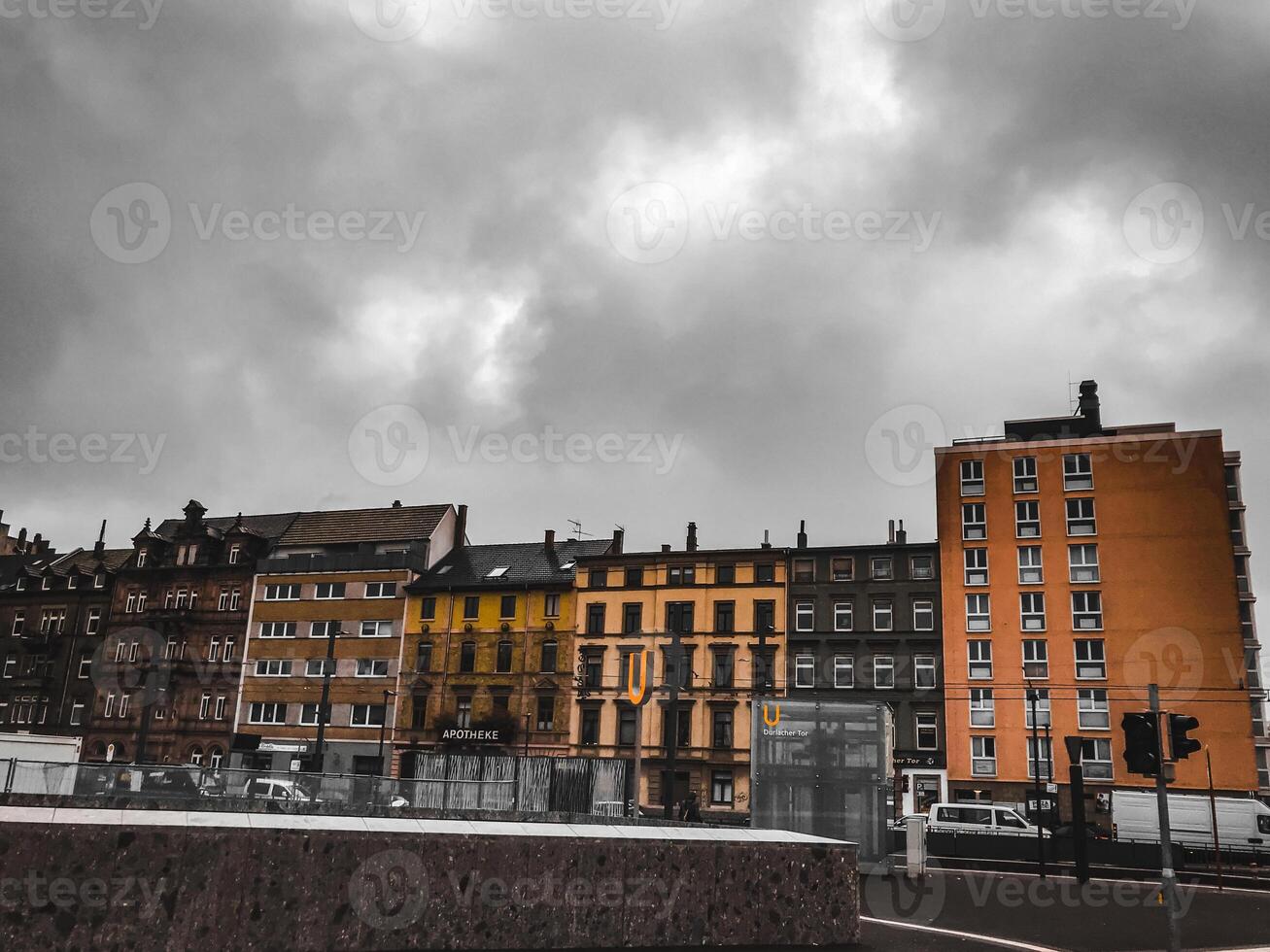 A city skyline with a cloudy sky and a few buildings photo