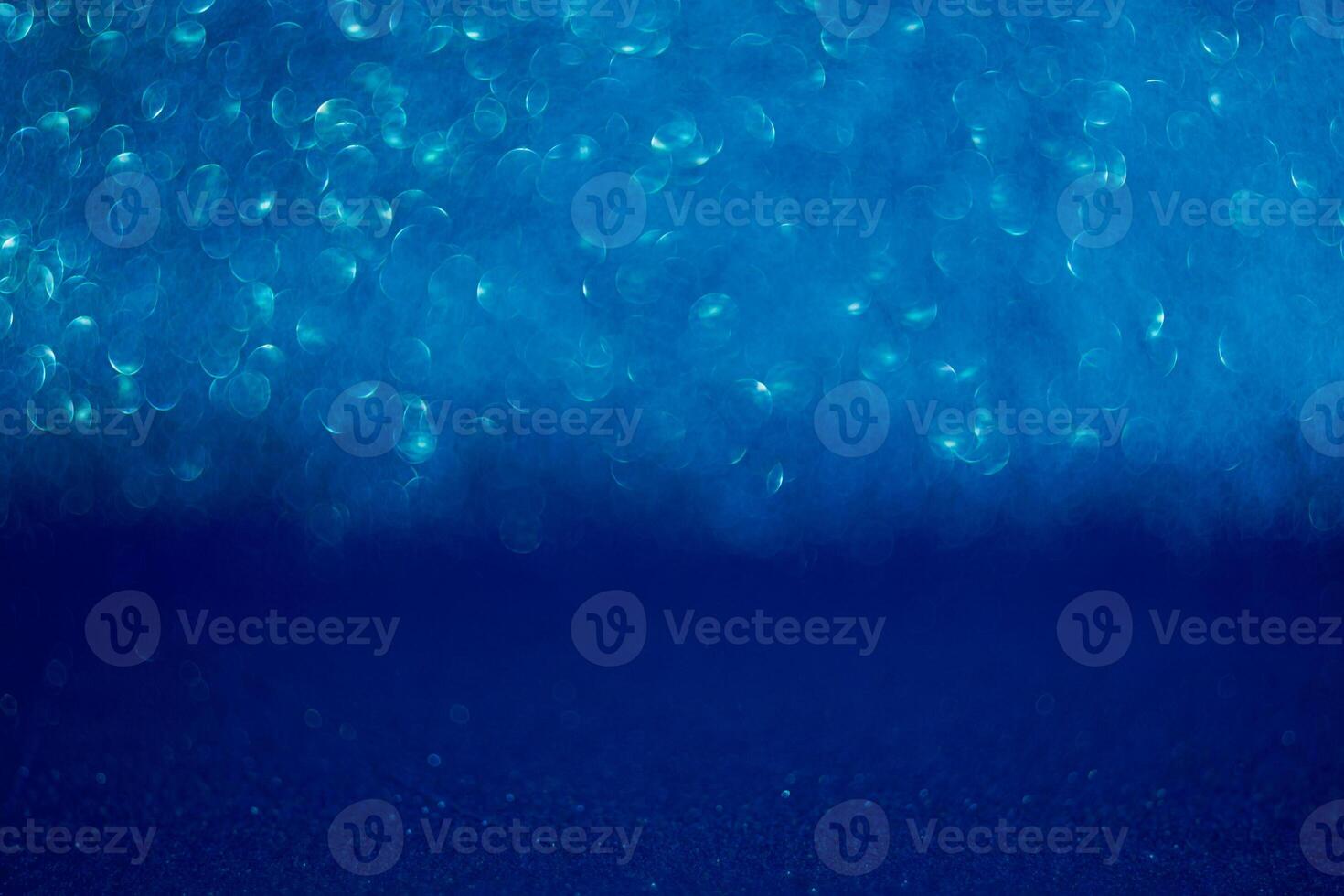 The image is a blue background with a lot of small blue dots photo
