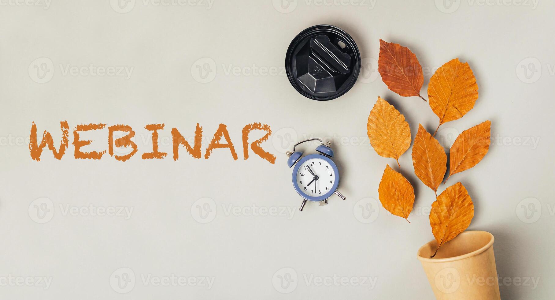 White background with a blue clock and a cup of coffee photo