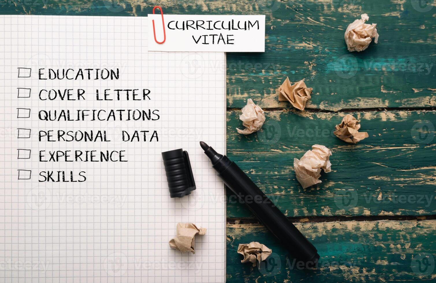 A black marker sits on a piece of paper with a list of skills and experience photo