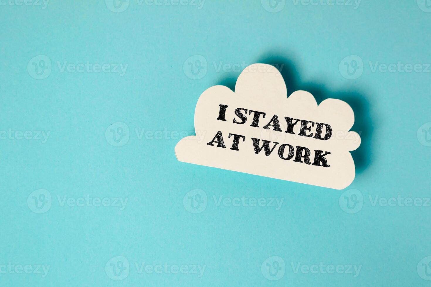 White cloud with the words I stayed at work written in black photo