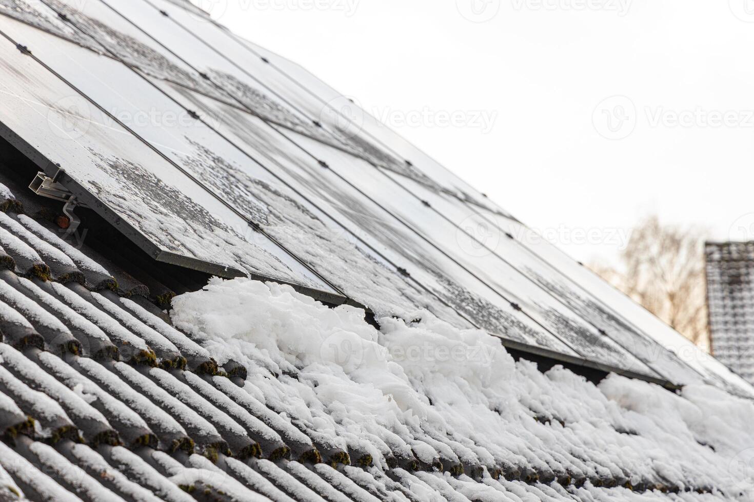 For solar panels to work in winter, it is important to regularly clear them of snow ice. Using special tools will protect the solar panel. This will ensure stable operation of solar panel in winter. photo
