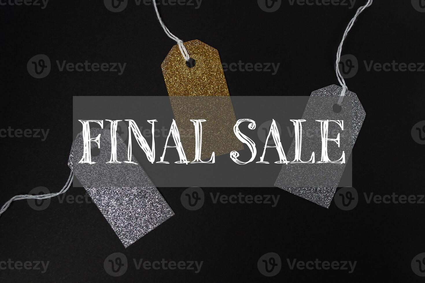 Black background with three tags that say Final Sale on it photo