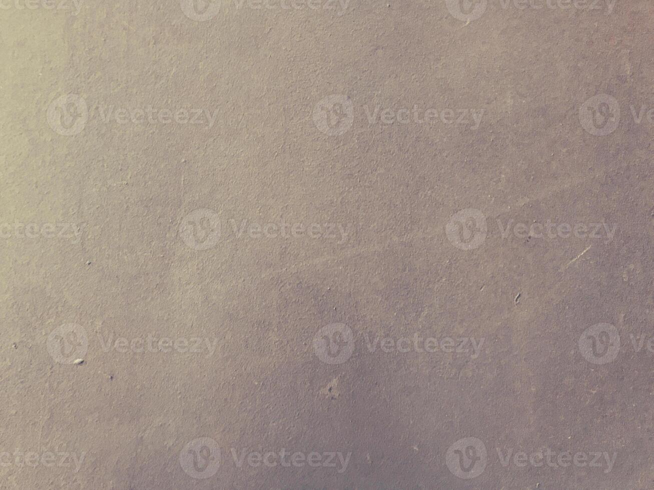 Grey wall with a few scratches and marks photo