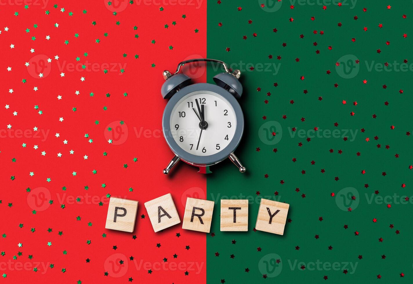 Clock is on a green background with the word party written below it photo