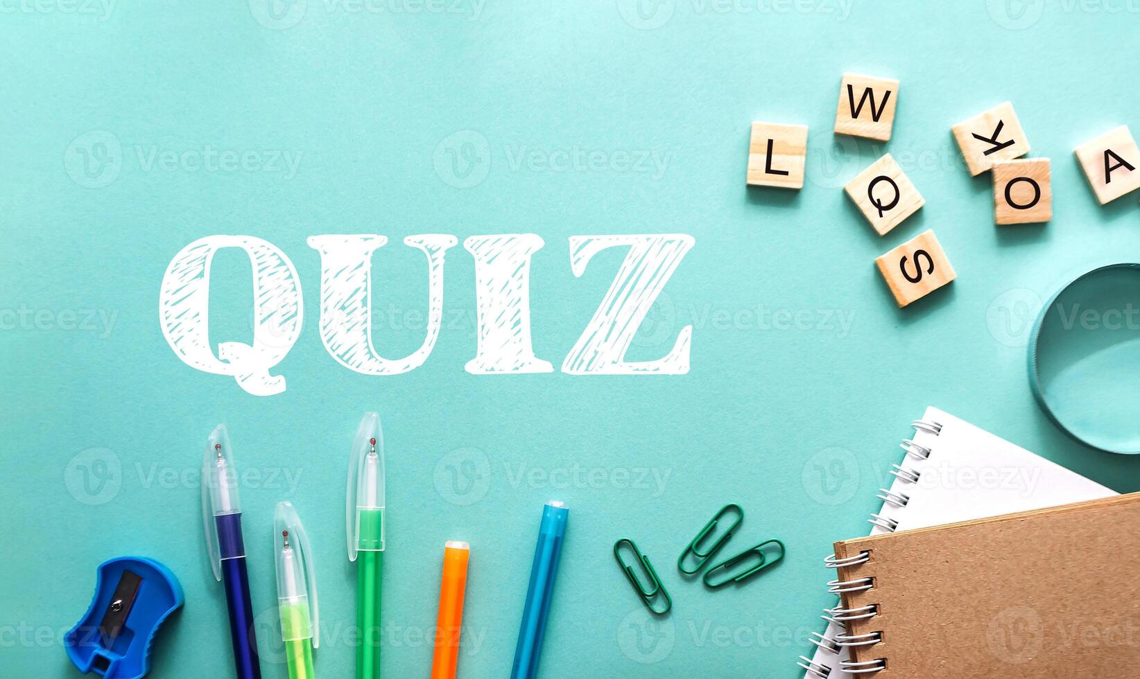 A green and blue background with a white word quiz written in white photo