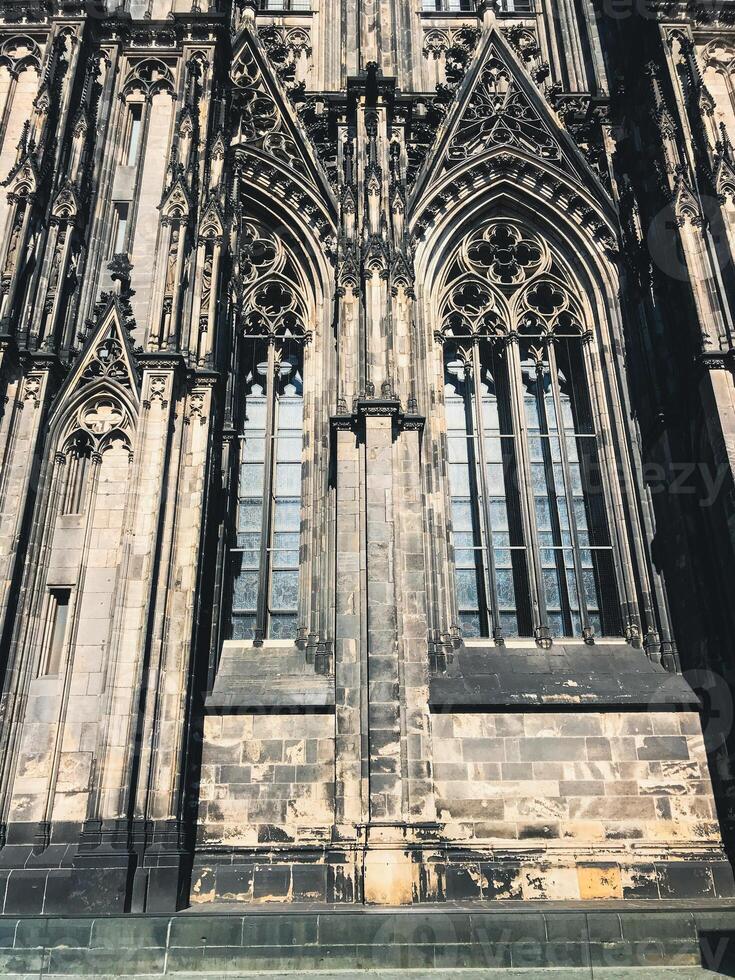Cathedral in Cologne. The building has a lot of windows and a lot of detail photo