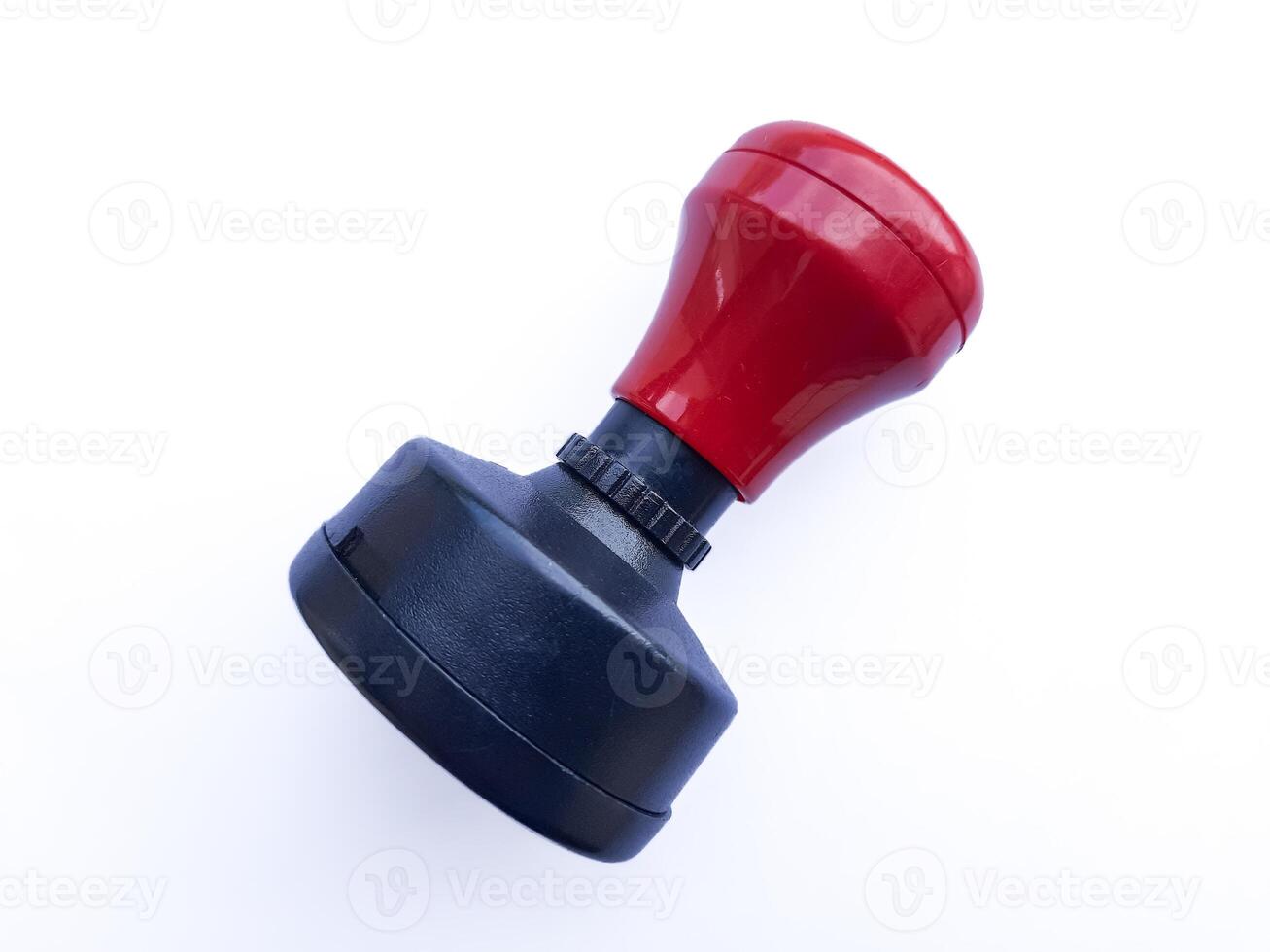 Red and Black Rubber Stamp Isolated on White Background photo