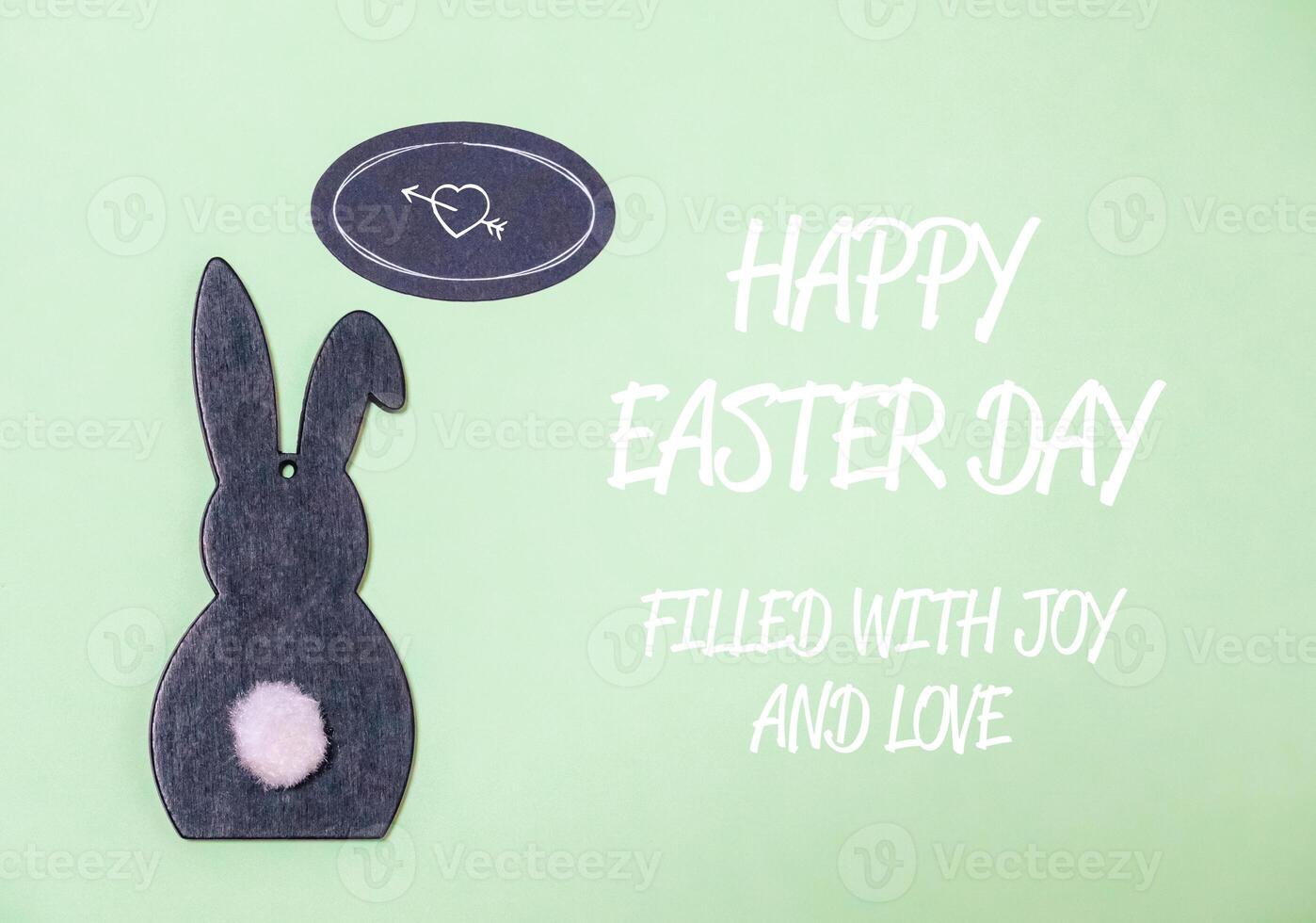 text congratulations for easter with a hare on a green background photo