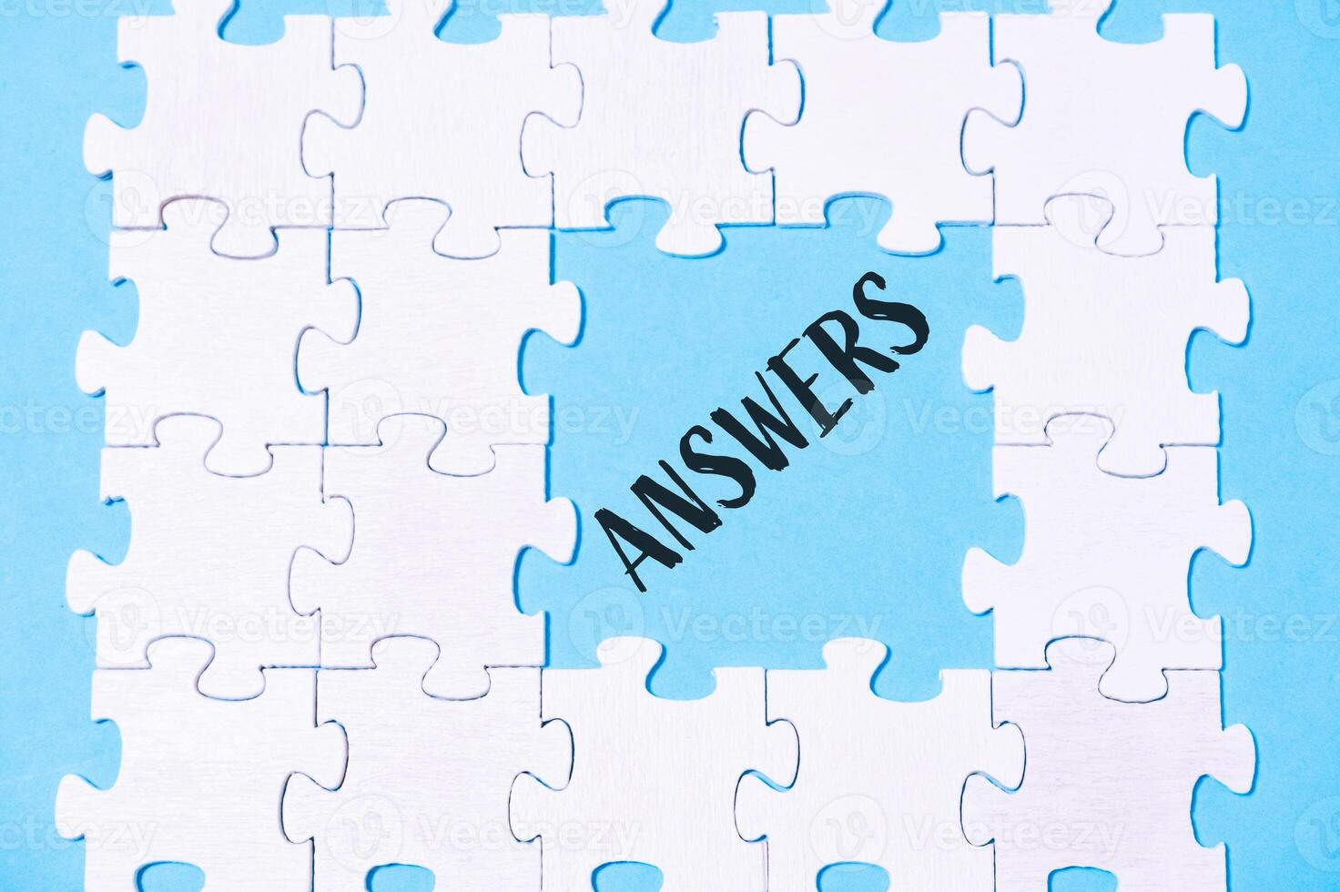 Puzzle with the word answers written in black on it photo