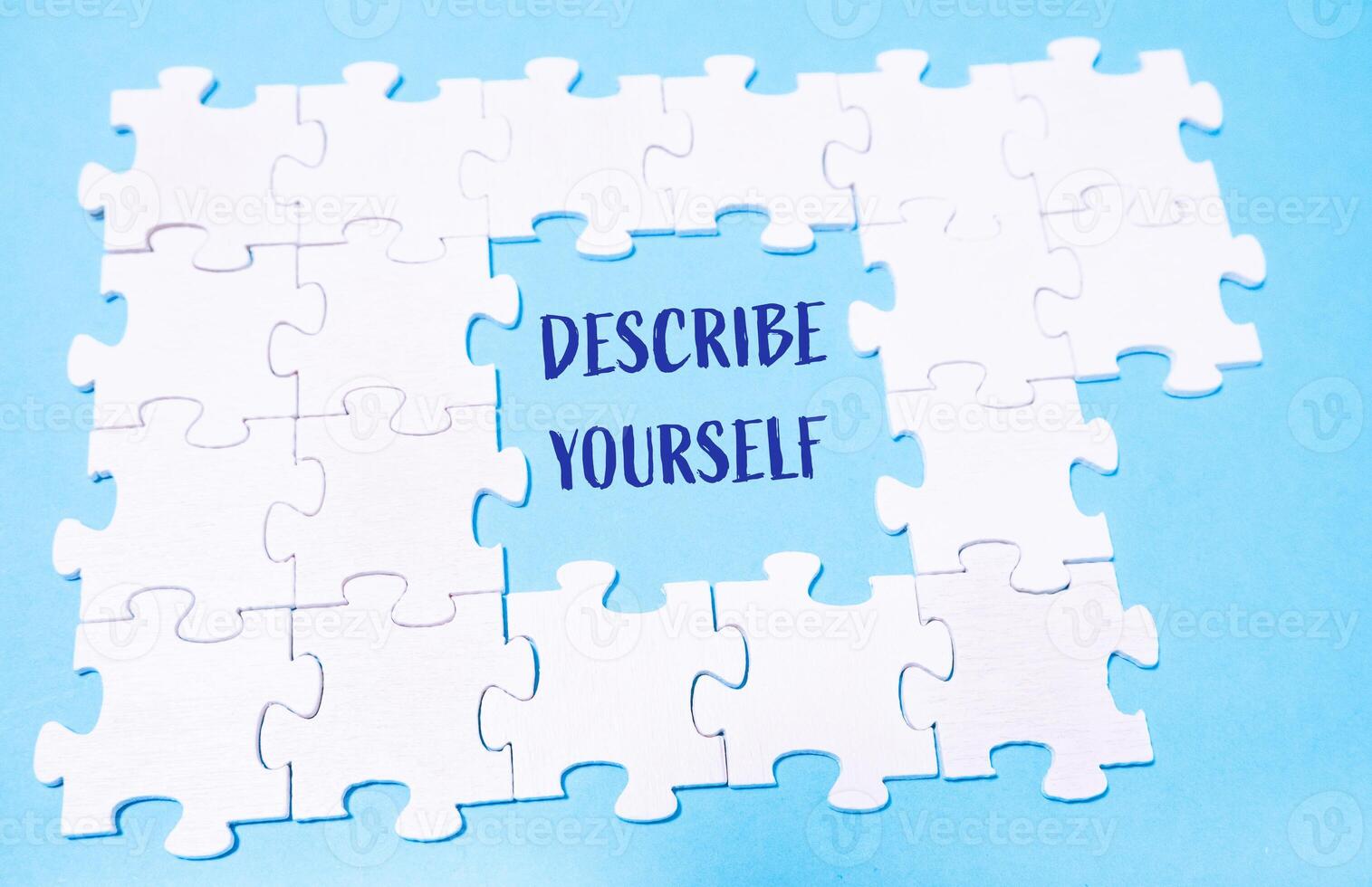 Puzzle with the words Describe yourself written in the middle photo