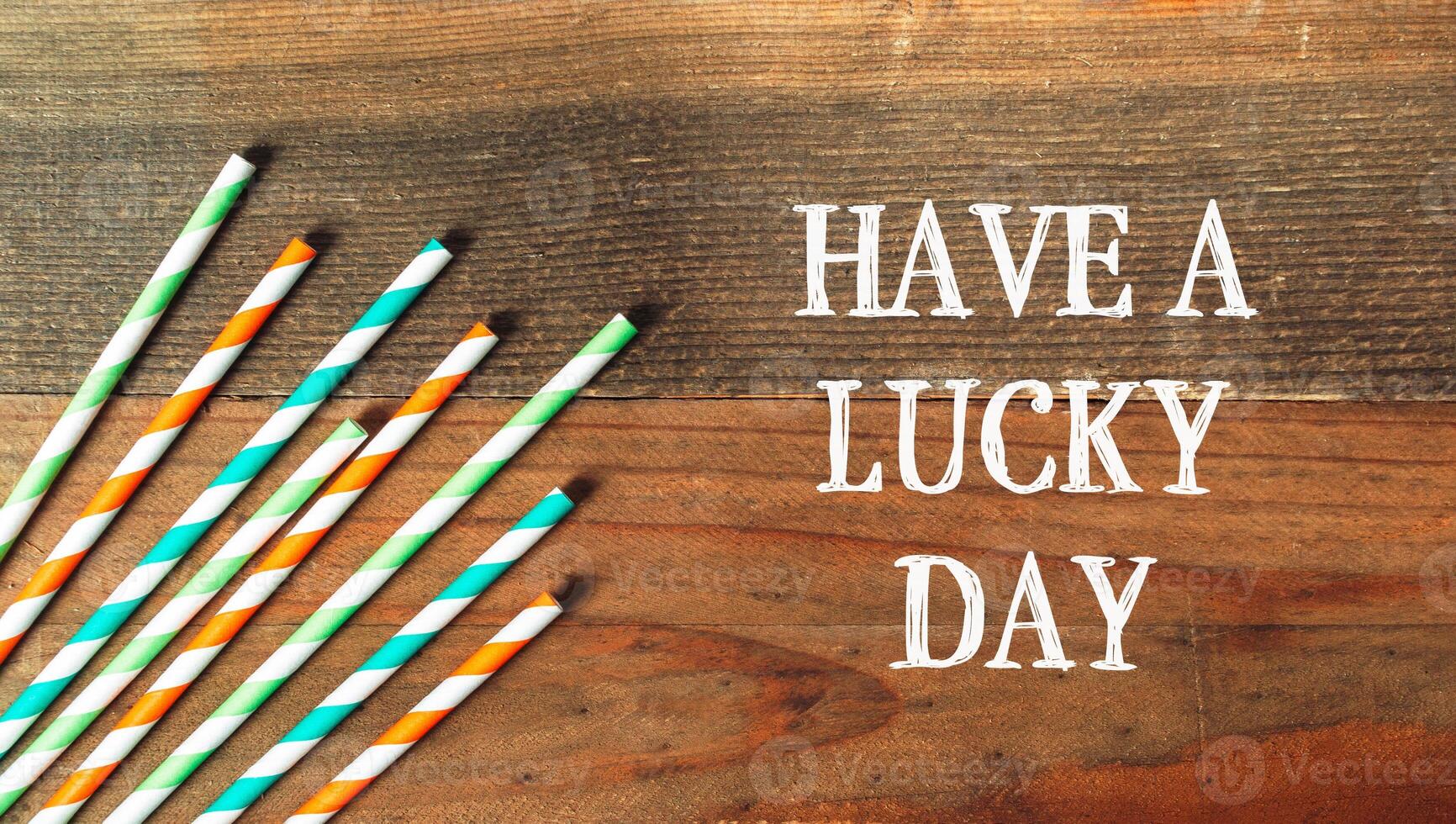 Have A Lucky Day on a wooden background photo