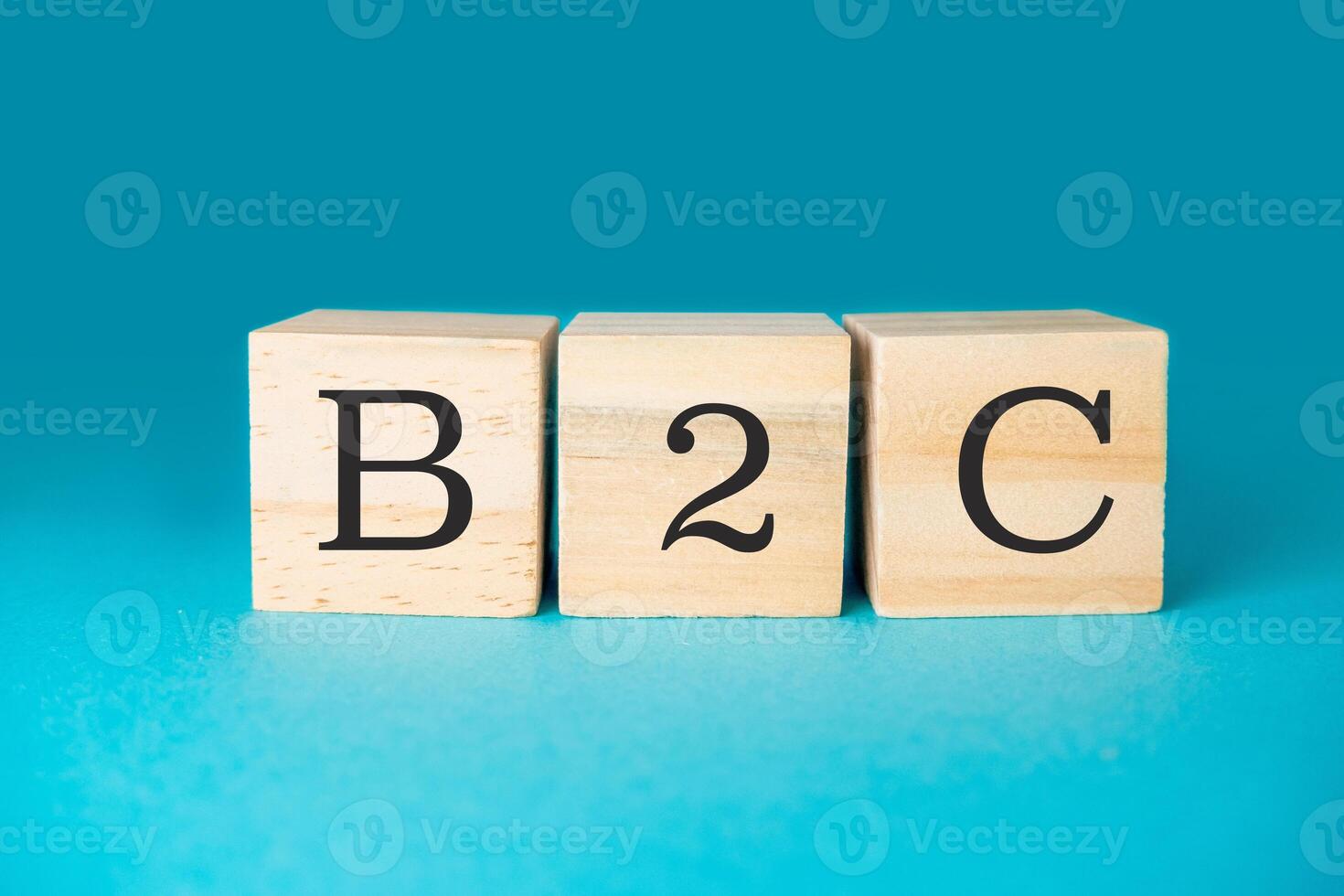 Three wooden blocks spell out the word B2C photo