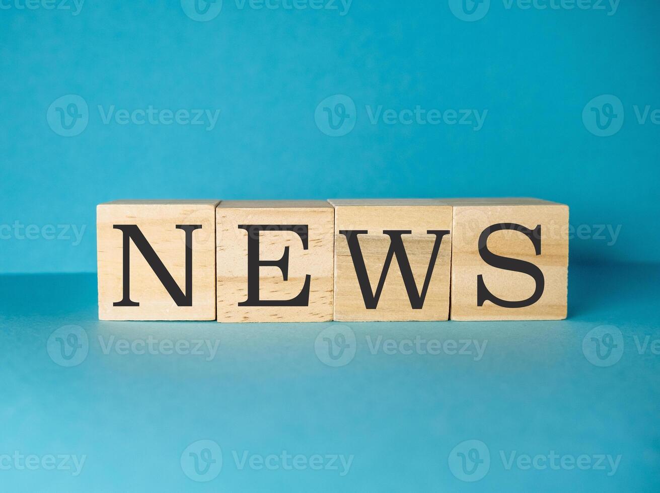Wooden block with the letters NEWS on it photo