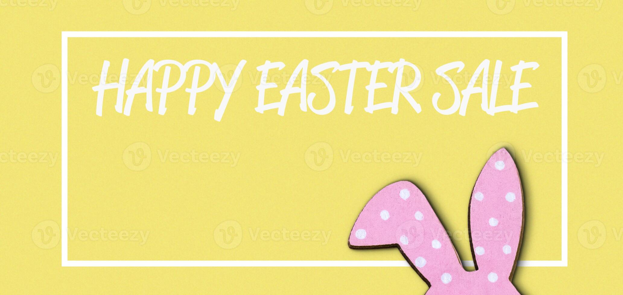Yellow background with a pink rabbit on it photo