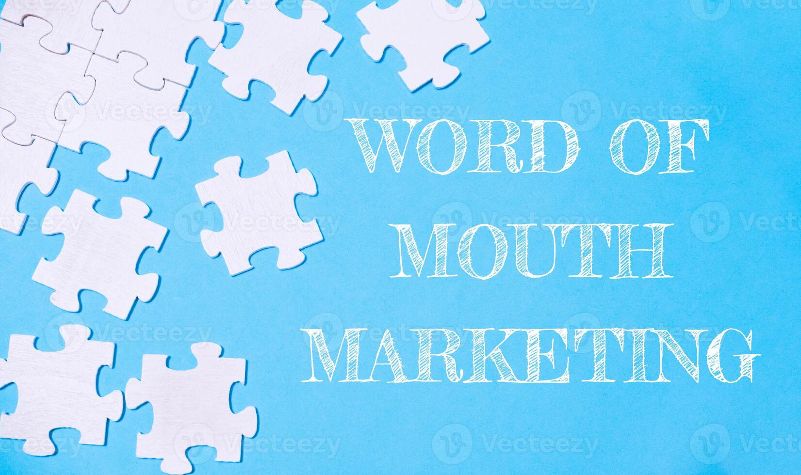 Puzzle with the word word of mouth marketing written on it photo