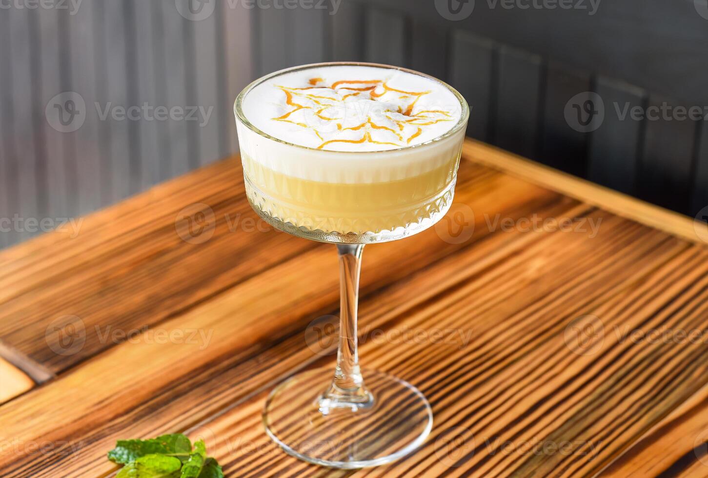 Alcohol cocktail Whisky sour on table against dark wall with copy space photo