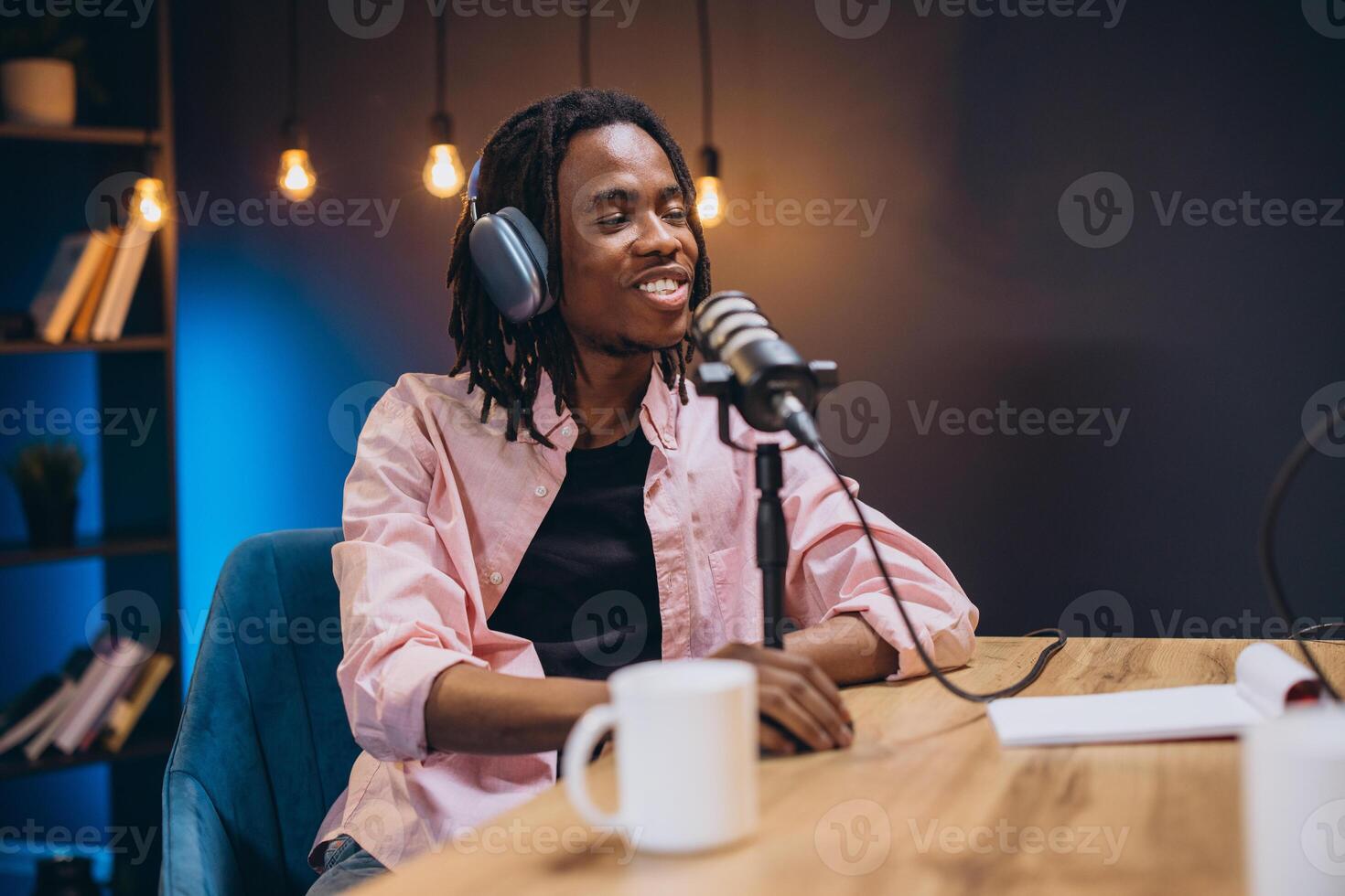 Radio host speaking into microphone, recording podcast in home studio, broadcasting professional audio content with passion photo