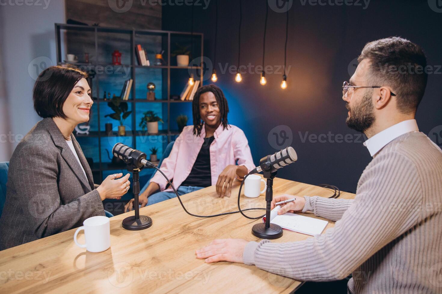 Content creators recording a new podcast episode, discussing and sharing their ideas with microphones in a professional studio photo