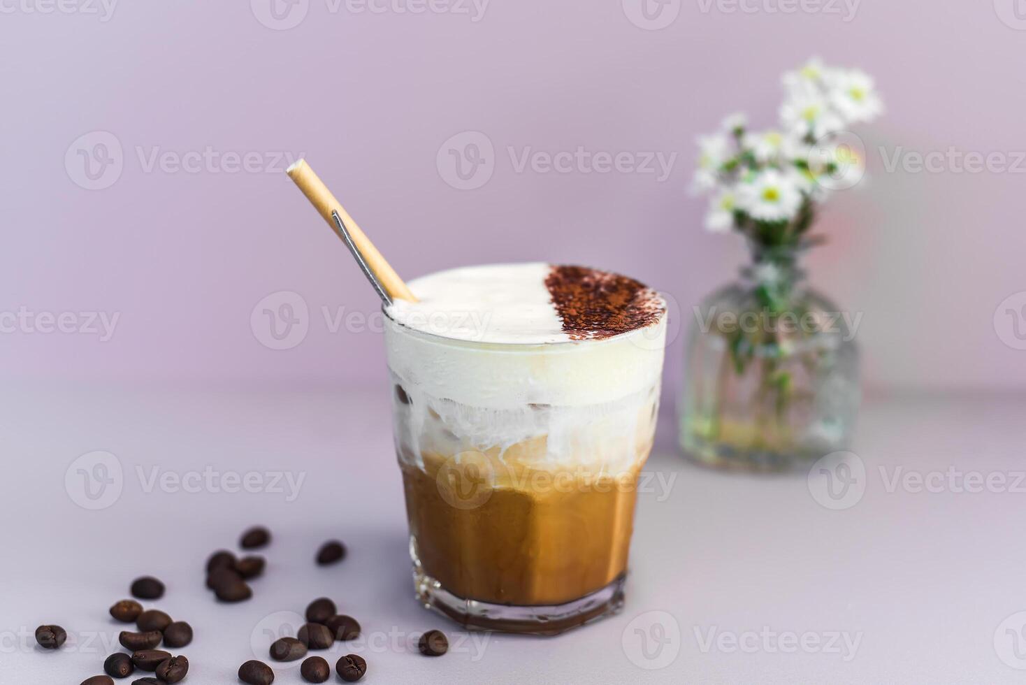 Vietnamese salted coffee with salty cheese cream ca phe muoi against green leaves photo