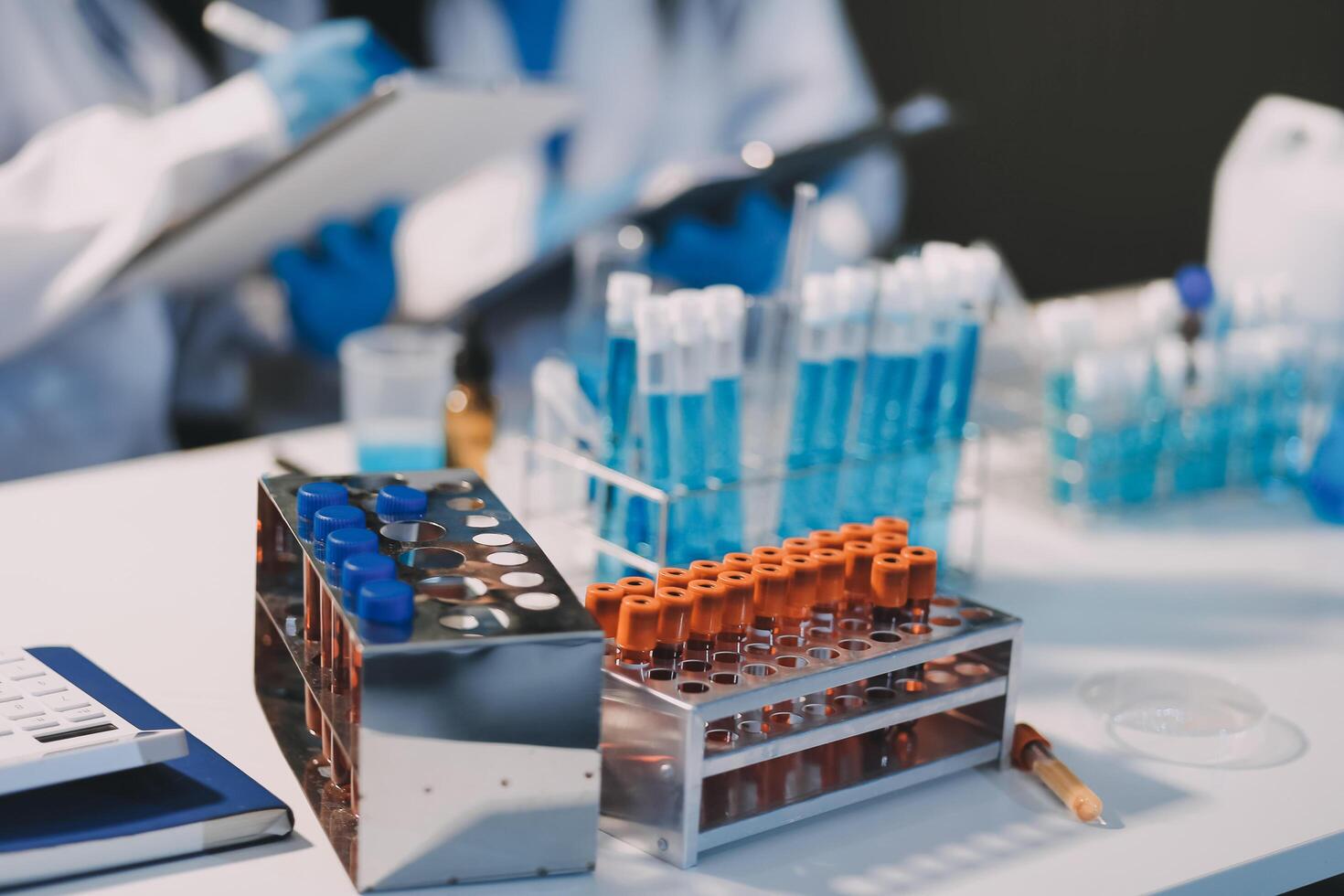 A laboratory table with several test tubes and other items photo