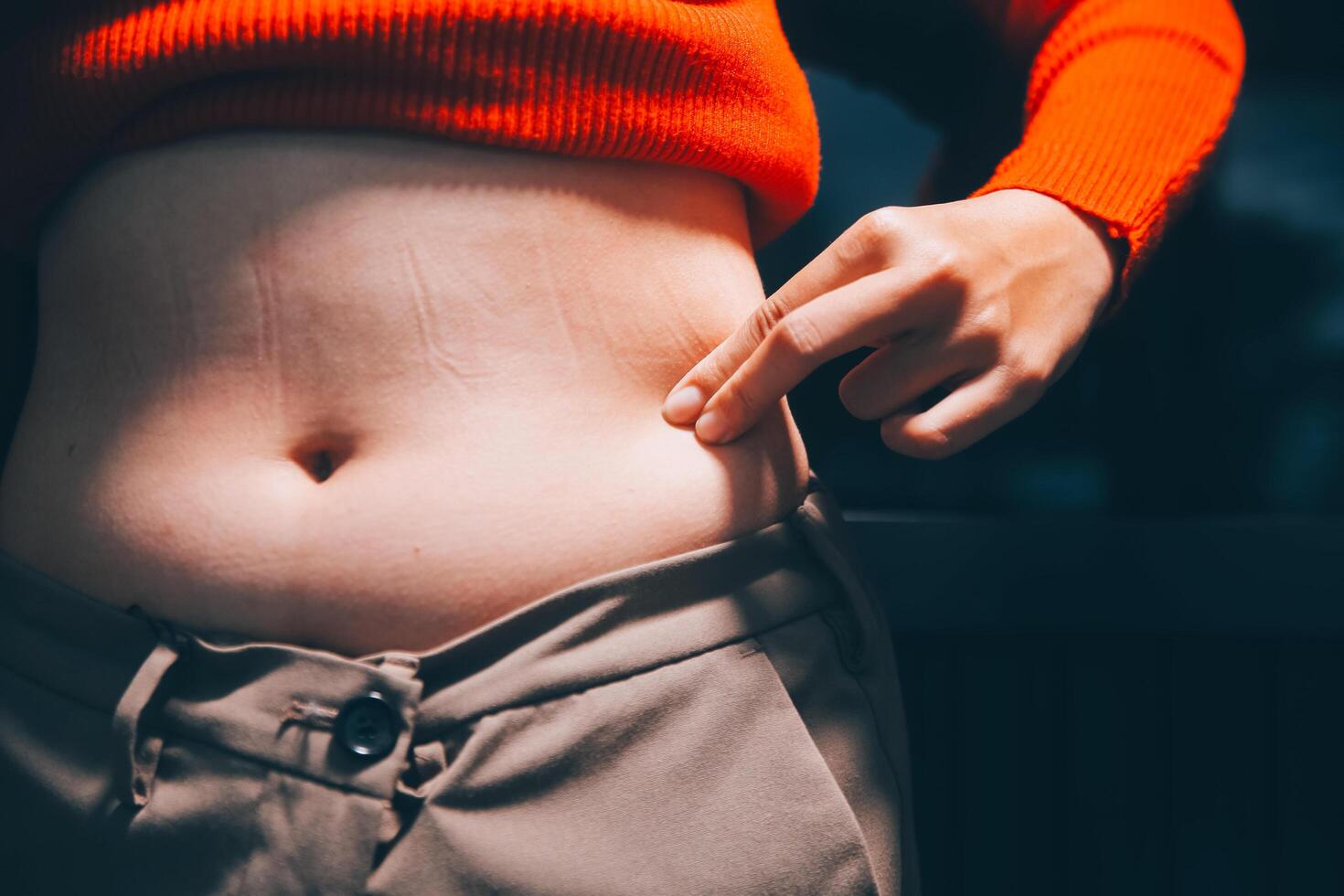 A woman with a tattoo on her stomach photo