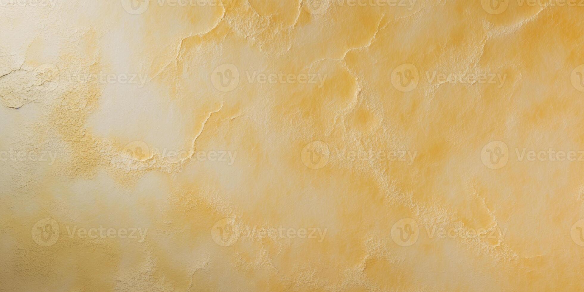 Textured golden yellow surface with subtle light variations perfect for backgrounds and design photo