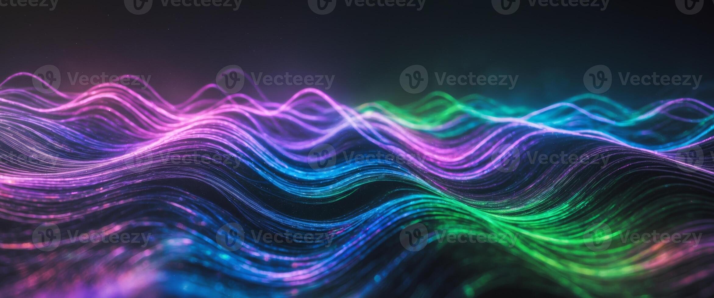 Colorful waves of light create an abstract and energetic visual display in the dark photo