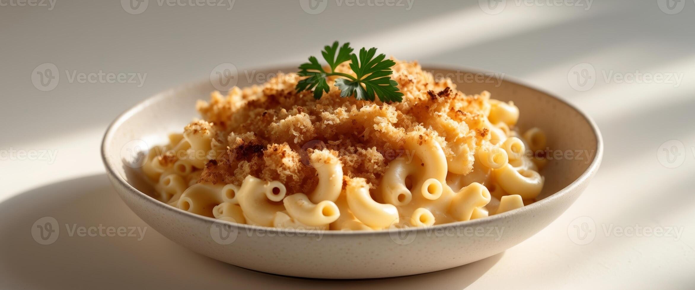 Creamy macaroni and cheese with golden brown breadcrumb topping and fresh parsley garnish photo