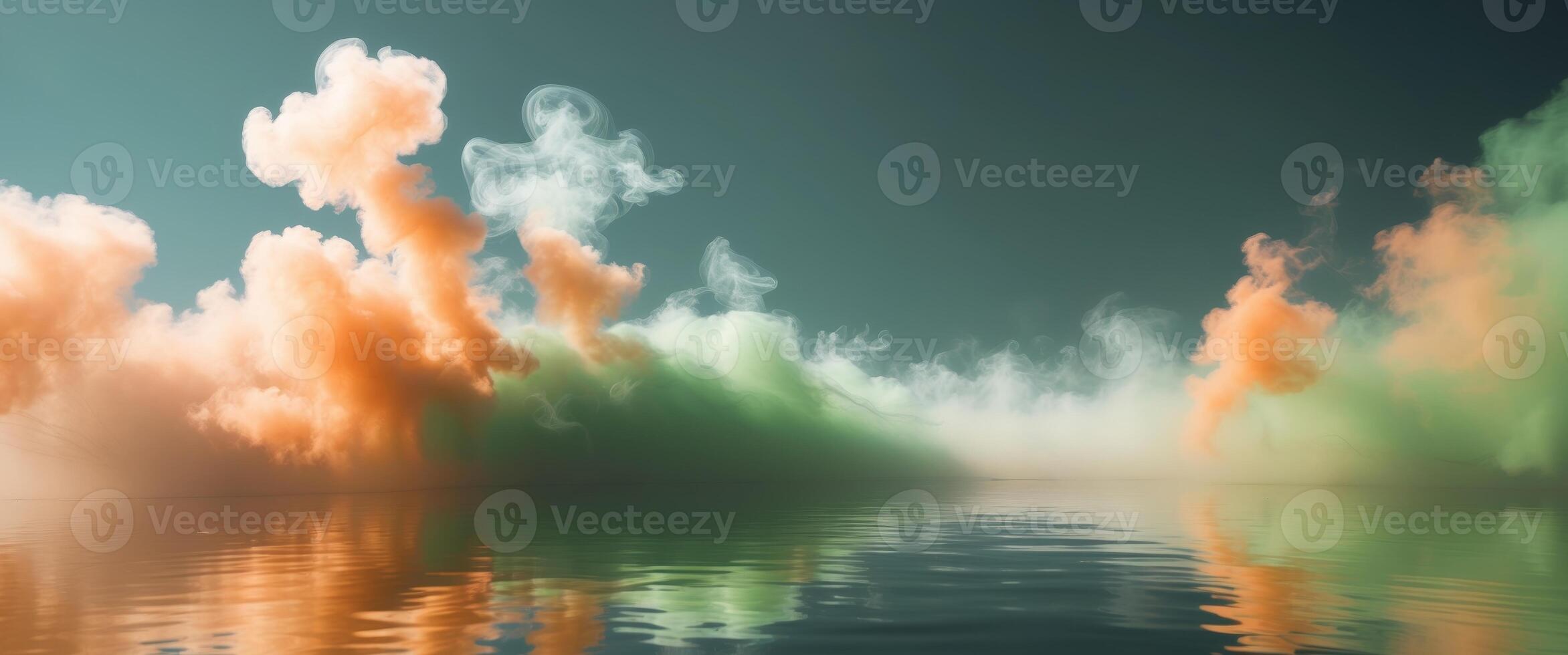 Abstract orange and green swirling smoke over water. photo