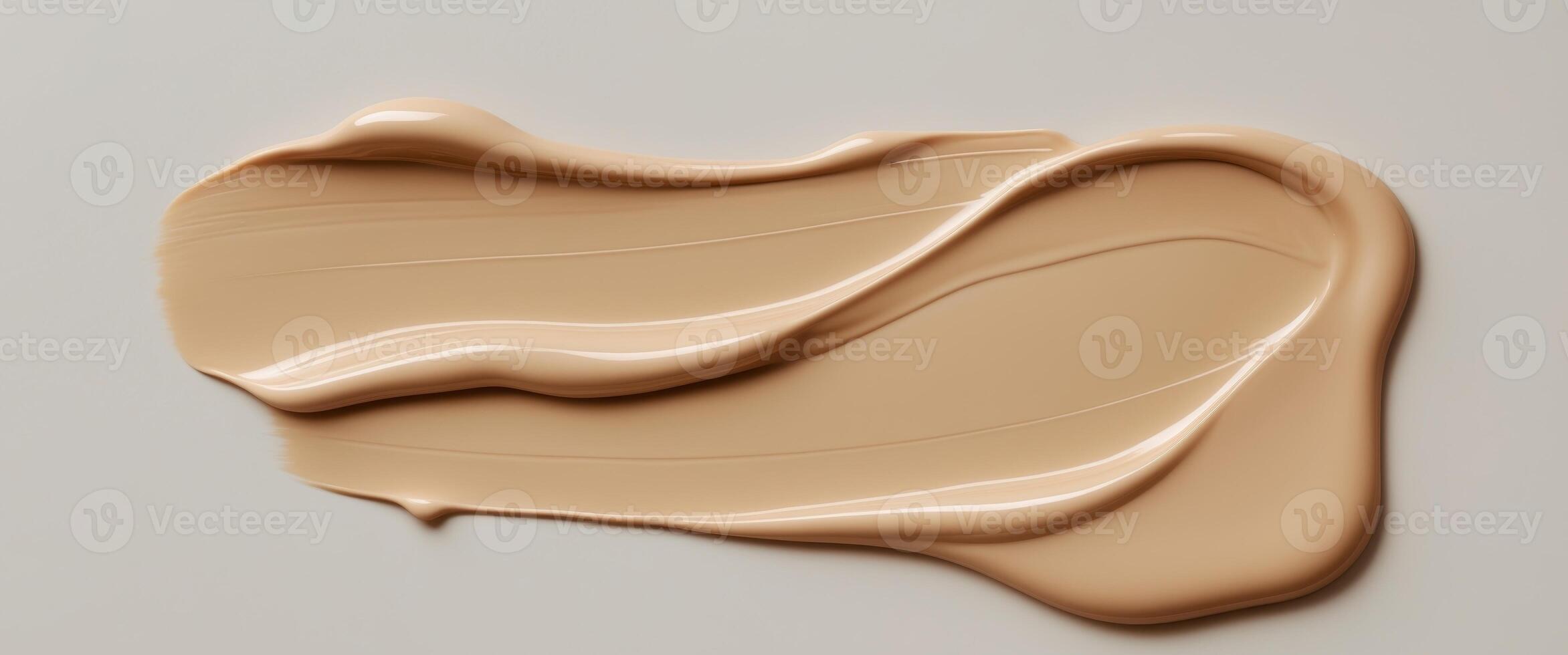 Beige liquid foundation makeup cream texture smudged background. photo