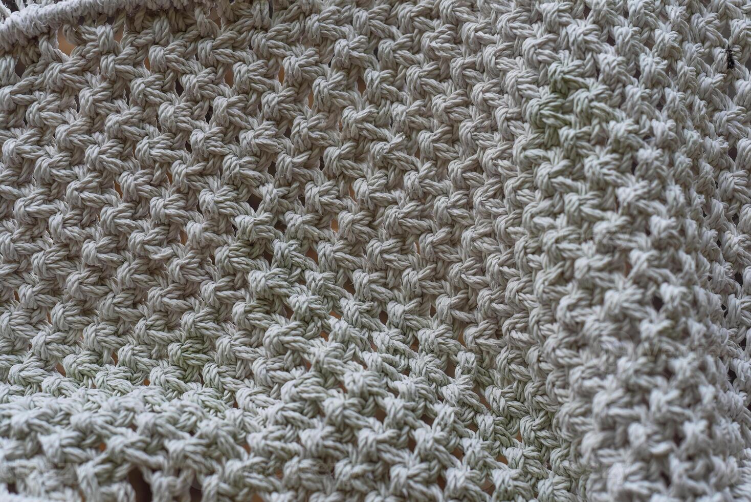 Various knots of macrame technique made of white threads photo
