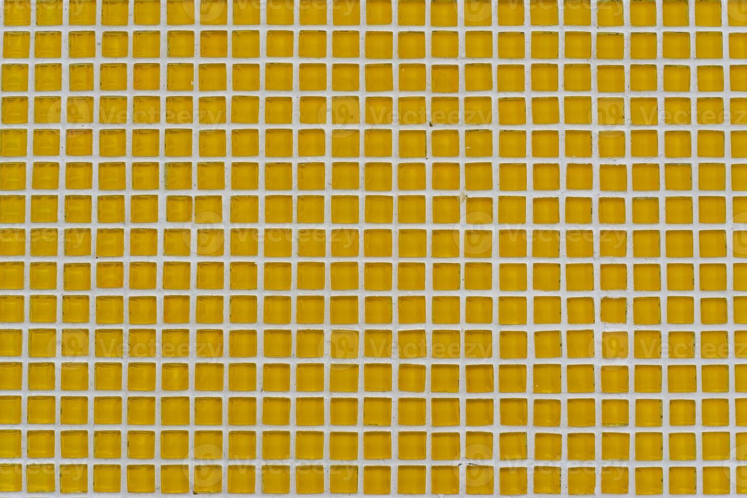 Background made of square small yellow mosaic with copy space photo