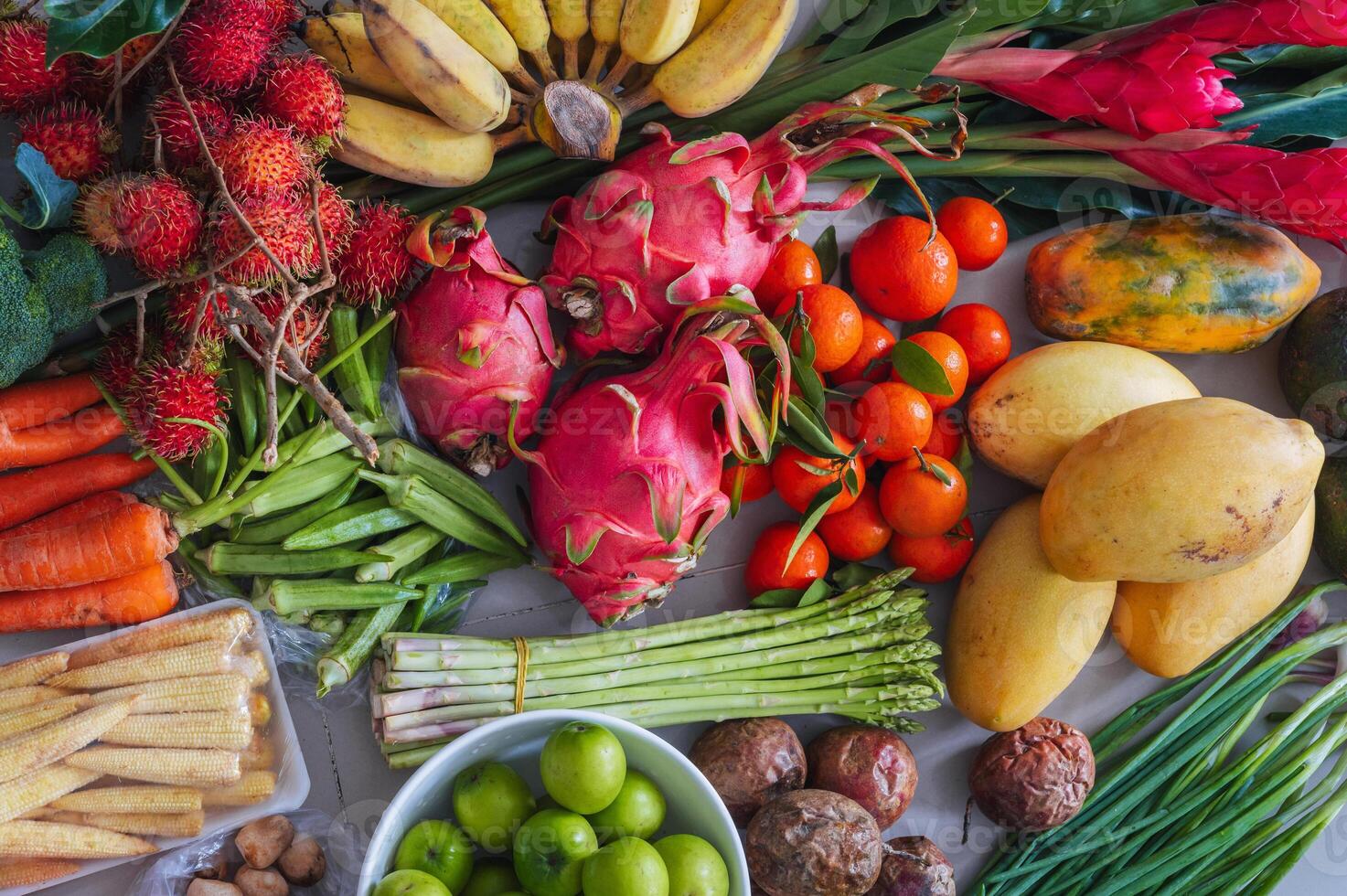 A set of fresh tropical vegetables and fruits purchased at a local Asian market photo