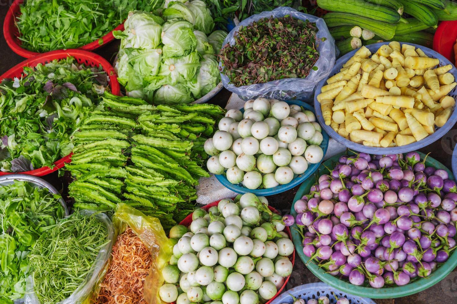 Various vegetables and herbs on the market in baskets. Asian vegetables. Vietnam Market photo