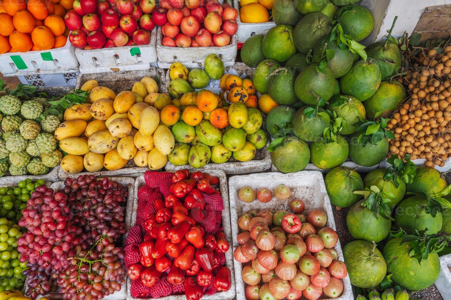 A counter with tropical fresh fruits at an Asian local market. photo