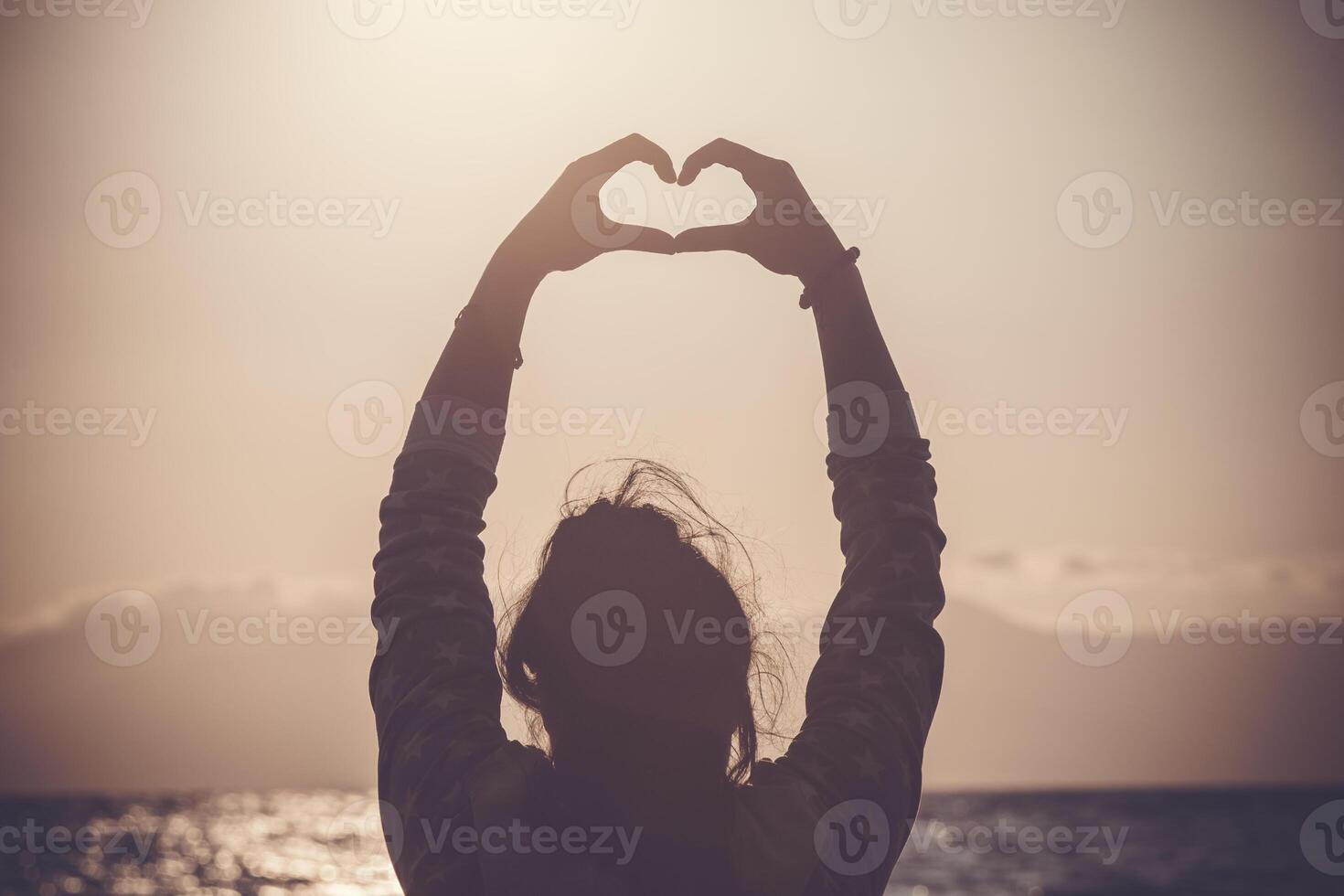 woman with hand shaped heart photo