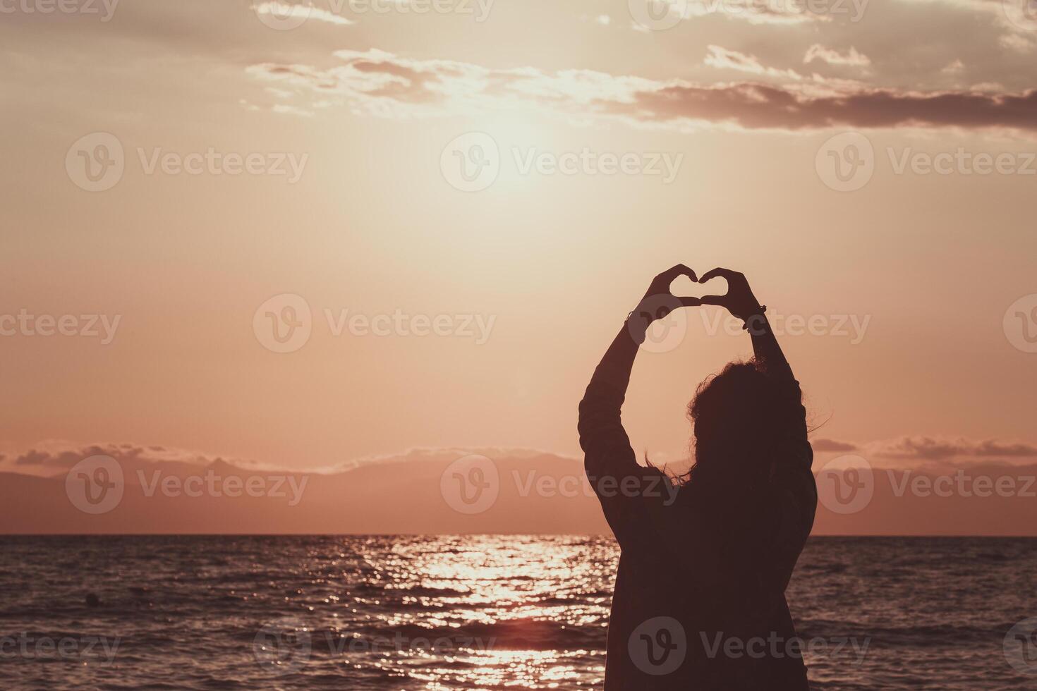 hand shaped heart at sea photo