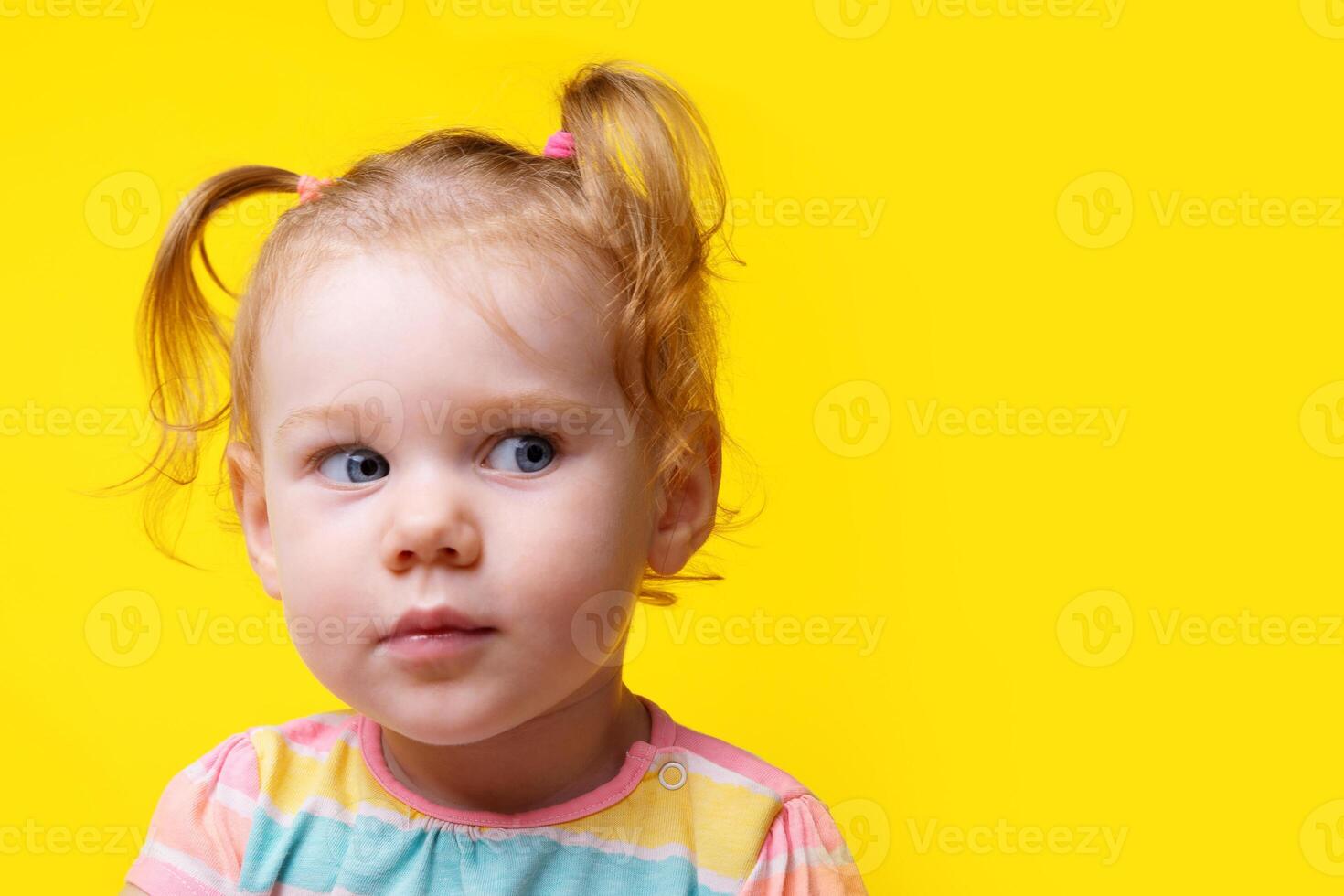 seriously baby girl looking side photo