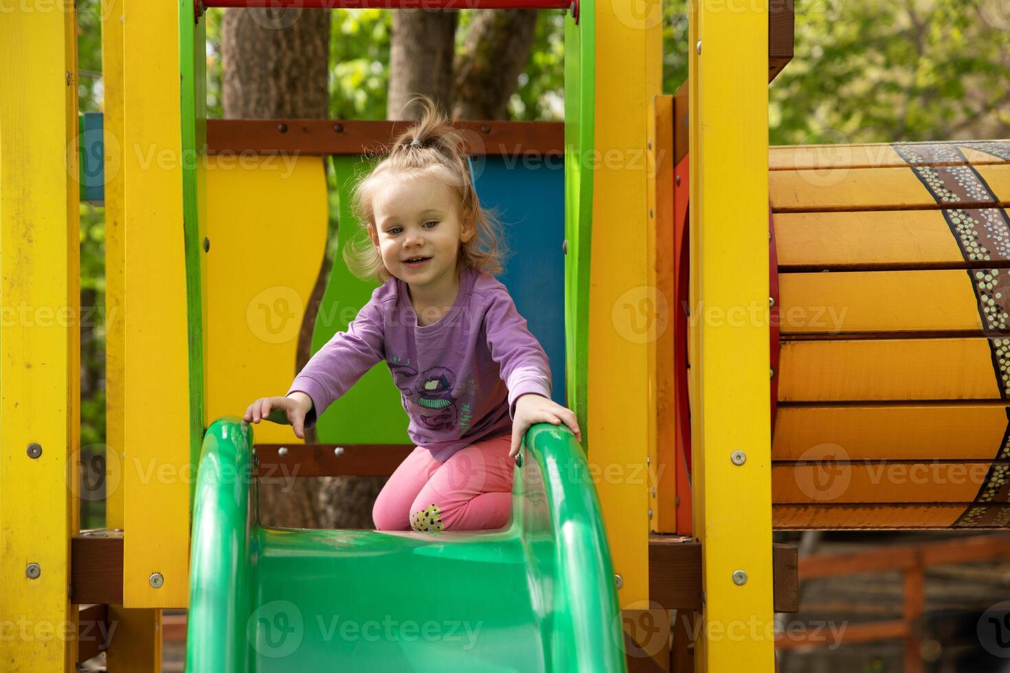 little girl playing in the playground photo