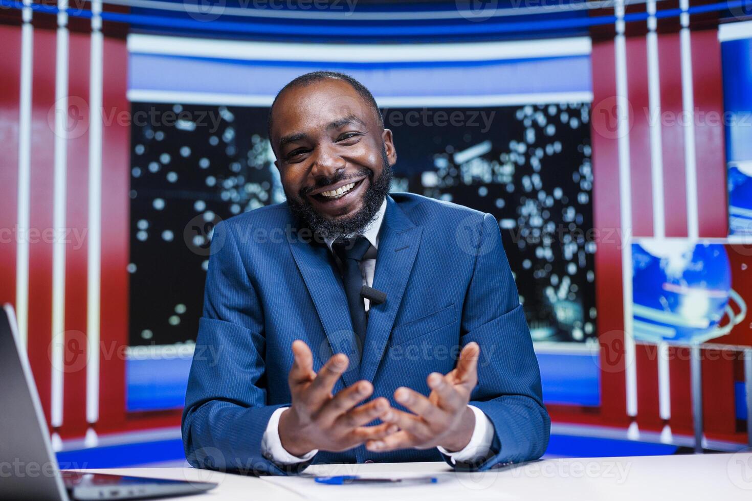 African american host presenting news on live broadcast tv program, using media headlines to create daily events reportage newscast. Man journalist working in television industry, night show. photo
