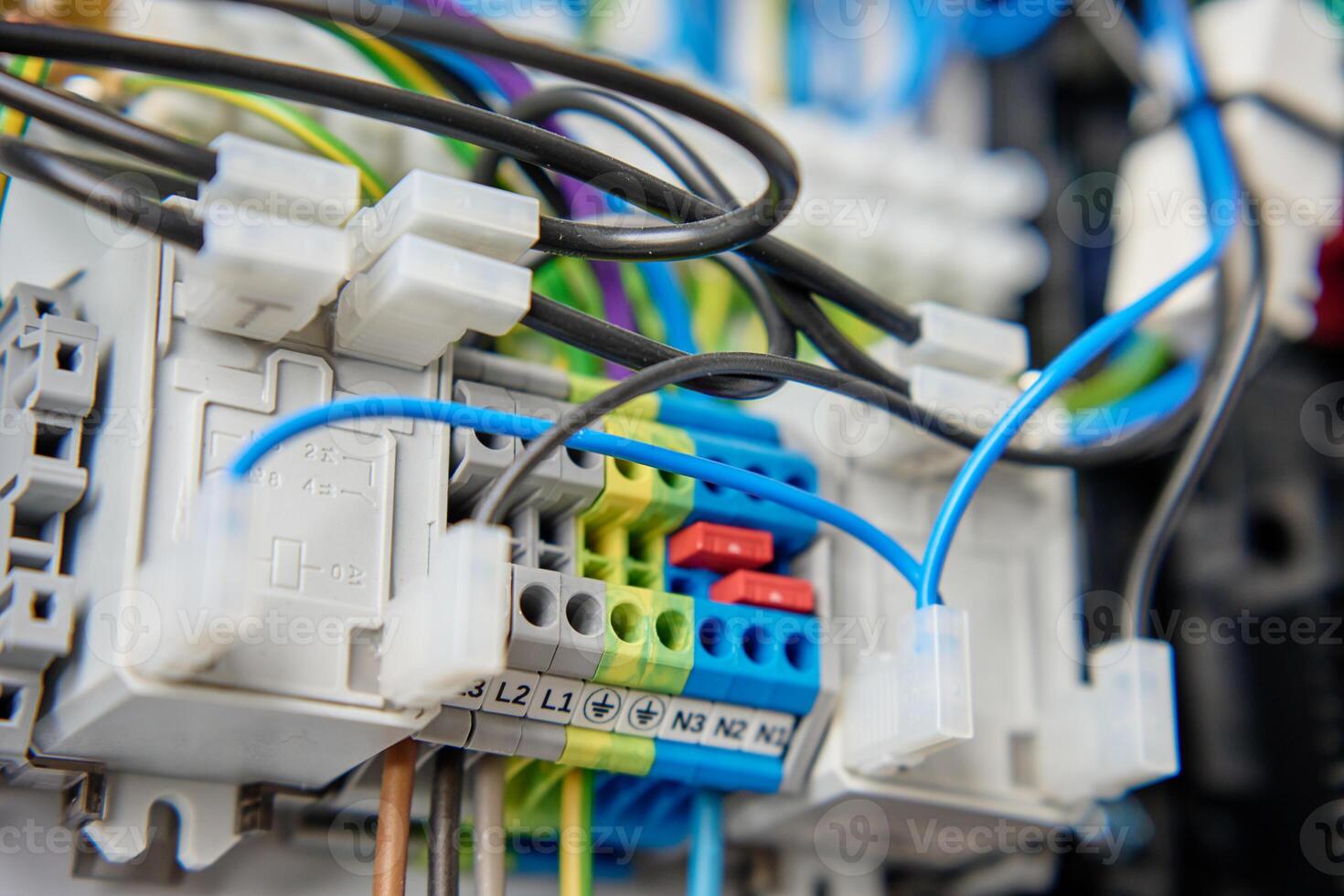 Electrical wires connecting to electrical circuit board in distribution box photo